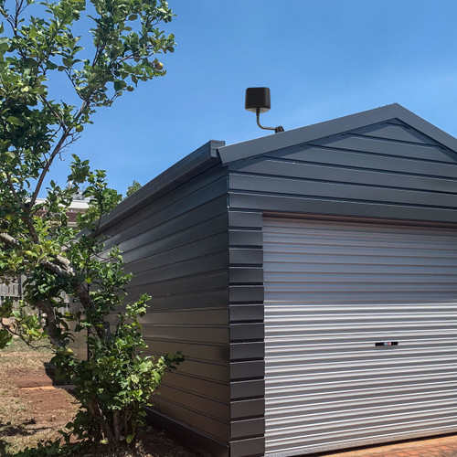 Extreme 2.0 High-Performance Outdoor WiFi Extender mounted to the roof of an exterior building to increase WiFi range on the property